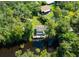 Aerial view showing home's waterfront location and surrounding nature at 4617 John Moore Rd, Brandon, FL 33511