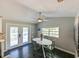 Kitchen dining area with white table and access to deck at 4617 John Moore Rd, Brandon, FL 33511