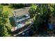 Aerial view of waterfront home with private dock and lush landscaping at 4617 John Moore Rd, Brandon, FL 33511