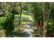 Aerial view of a home with pond and lush landscaping at 4617 John Moore Rd, Brandon, FL 33511