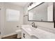 Modern bathroom with marble vanity and walk-in shower at 302 Springdale Pl, Temple Terrace, FL 33617