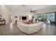 Large living room with a sectional sofa and access to the pool at 824 Citrus Wood Ln, Valrico, FL 33594