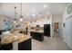 Modern kitchen with granite countertops, stainless steel appliances, and an island at 824 Citrus Wood Ln, Valrico, FL 33594
