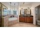 Elegant bathroom with double vanity, soaking tub, and separate shower at 824 Citrus Wood Ln, Valrico, FL 33594