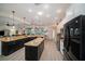 Modern kitchen with granite countertops, stainless steel appliances, and an island at 824 Citrus Wood Ln, Valrico, FL 33594