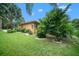 Landscaped yard with lush greenery and mature trees at 824 Citrus Wood Ln, Valrico, FL 33594
