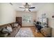 Home office features a comfortable couch, a vanity, and a ceiling fan at 824 Citrus Wood Ln, Valrico, FL 33594