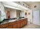 Clean bathroom with double sinks, granite countertop and exterior access at 824 Citrus Wood Ln, Valrico, FL 33594