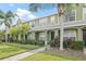 Green townhome with landscaping and walkway at 11622 Colony Lake Dr, Tampa, FL 33635