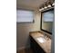 Updated bathroom with granite countertop, modern vanity, and large mirror at 4606 W Gray St # 110, Tampa, FL 33609