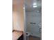 Accessible bathroom with shower stall, grab bars, and toilet at 4606 W Gray St # 110, Tampa, FL 33609