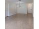 Spacious living room with tile floors and chandelier at 4606 W Gray St # 110, Tampa, FL 33609