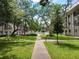 Landscaped community courtyard with walkways at 4606 W Gray St # 110, Tampa, FL 33609