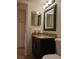 Clean bathroom with granite countertop and large mirror at 4606 W Gray St # 110, Tampa, FL 33609