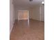 Large living room with tile floors and sliding doors at 4606 W Gray St # 110, Tampa, FL 33609