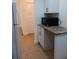 Kitchenette with microwave and granite countertop at 4606 W Gray St # 110, Tampa, FL 33609
