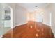 Hardwood floor living room with open concept to kitchen and Gathering room at 1704 Cresswell Manor Ct, Dover, FL 33527