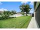 Landscaped backyard with shed and grassy area at 1704 Cresswell Manor Ct, Dover, FL 33527
