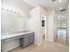 Main bathroom with granite countertop, double sinks and a toilet at 1704 Cresswell Manor Ct, Dover, FL 33527