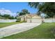 Two-story house with a two-car garage and nicely landscaped yard at 1704 Cresswell Manor Ct, Dover, FL 33527