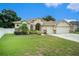 Two-story house with a two-car garage and nicely landscaped yard at 1704 Cresswell Manor Ct, Dover, FL 33527