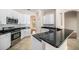 Modern kitchen with stainless steel appliances and dark granite countertops at 1704 Cresswell Manor Ct, Dover, FL 33527