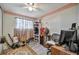Well-lit bedroom with a desk, shelving, and ample closet space at 122 E Saint Annes Cir, Apollo Beach, FL 33572