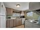 Clean and functional kitchen with ample cabinetry and a full suite of appliances at 122 E Saint Annes Cir, Apollo Beach, FL 33572