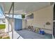 Covered patio with storage shed and additional space at 122 E Saint Annes Cir, Apollo Beach, FL 33572