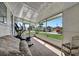 Relaxing screened porch with room for exercise equipment and seating at 122 E Saint Annes Cir, Apollo Beach, FL 33572