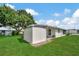 Large backyard with shed and grassy area at 122 E Saint Annes Cir, Apollo Beach, FL 33572