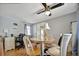 Bright dining area with wood floors, a round table, and four chairs at 122 E Saint Annes Cir, Apollo Beach, FL 33572