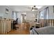 Open dining area with wood floors and a view of the kitchen at 122 E Saint Annes Cir, Apollo Beach, FL 33572