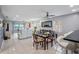 Bright dining area with glass table, chairs, and view into living room at 1819 Shore S Dr # 318, South Pasadena, FL 33707