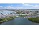 Wide aerial view of waterfront community, marina, and city skyline at 1819 Shore S Dr # 318, South Pasadena, FL 33707