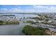 Wide aerial view of waterfront community, marina, and city skyline at 1819 Shore S Dr # 318, South Pasadena, FL 33707
