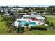 Community pool with a clubhouse and surrounding landscaping at 6404 Key Island Ave, Apollo Beach, FL 33572
