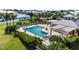 Community pool with a clubhouse and surrounding landscape at 6404 Key Island Ave, Apollo Beach, FL 33572