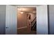 Upstairs hallway leading to laundry room and stairs at 5776 Newberry Pines Ave, Wesley Chapel, FL 33545