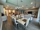 Open dining room with large table and chairs, adjacent to kitchen at 5776 Newberry Pines Ave, Wesley Chapel, FL 33545