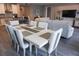 Bright dining room with large table and seating for six at 5776 Newberry Pines Ave, Wesley Chapel, FL 33545