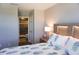 Bedroom with ensuite bathroom and a pineapple comforter at 5776 Newberry Pines Ave, Wesley Chapel, FL 33545