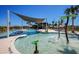 Community pool with water features and a shade structure at 5776 Newberry Pines Ave, Wesley Chapel, FL 33545