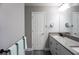 Bright bathroom with a double vanity and an additional linen closet at 5776 Newberry Pines Ave, Wesley Chapel, FL 33545