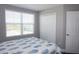 Bedroom with double door closet and window at 5776 Newberry Pines Ave, Wesley Chapel, FL 33545