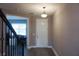 Foyer with view of staircase and entry door at 5776 Newberry Pines Ave, Wesley Chapel, FL 33545