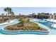 Lazy river style resort pool with a clubhouse in the background at 5776 Newberry Pines Ave, Wesley Chapel, FL 33545