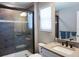 Bathroom with walk-in shower and modern vanity at 5776 Newberry Pines Ave, Wesley Chapel, FL 33545