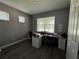 Bright home office with large desk and window at 5776 Newberry Pines Ave, Wesley Chapel, FL 33545
