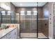 Bathroom with a large walk-in shower at 5776 Newberry Pines Ave, Wesley Chapel, FL 33545